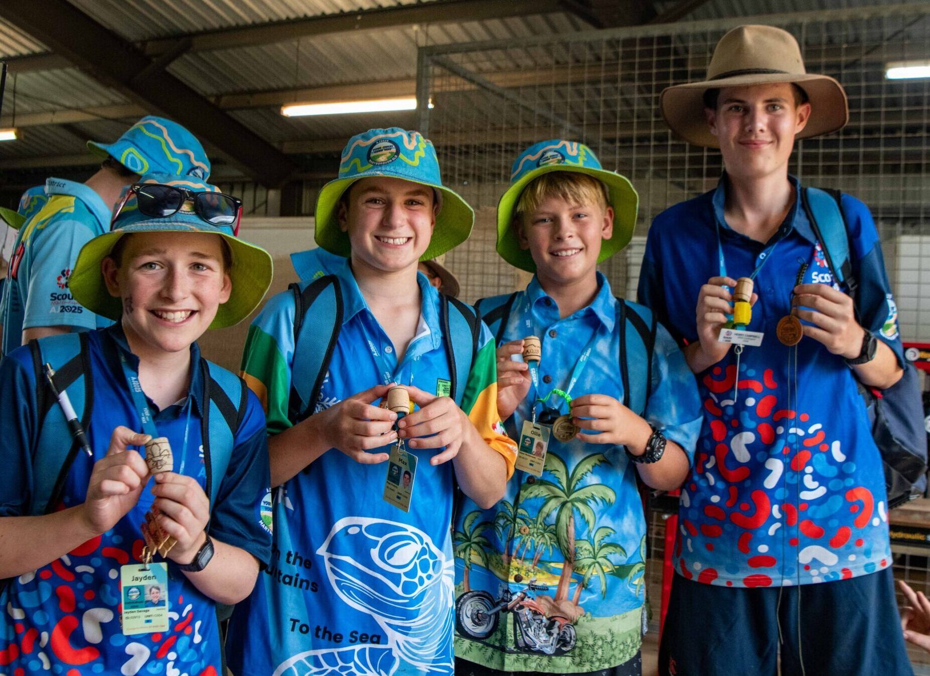 four scouts at the australian jamboree AJ2025 in maryborough, queensland